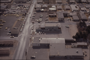 Color aerial view of Las Vegas. The Culinary Workers Union Local 226 building is visible across the street from a yellow cab company parking lot.