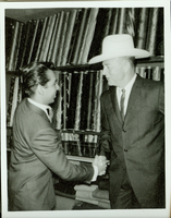 Rex Bell with an unidentified man: photographic print