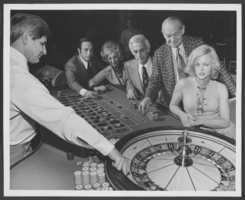 Photograph of gamblers at a roulette table in the Aladdin Hotel, Las Vegas, Nevada, circa early 1970s
