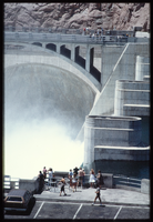 People gather to watch water flowing down the Arizona spillway, looking south at Hoover Dam, Arizona: photographic slide