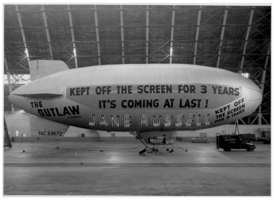 Photograph of a blimp advertising The Outlaw starring Jane Russell, 1943
