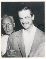 Photograph of Howard Hughes after the landing of the second XF-11, 1947