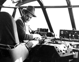 Photograph of Howard Hughes at the Flying Boat's controls, Los Angeles Harbor, November 1, 1947