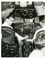 Photograph of Howard Hughes at the TWA Constellation controls, May 1, 1947