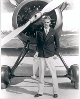 Photograph of Howard Hughes in front of his biplane, Miami, 1934