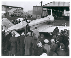 Photograph of Howard Hughes leaving the Northrop Gamma Racer, Newark, New Jersey, January 13, 1936