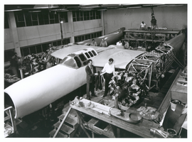 Photograph of Howard Hughes supervising construction of the D-2, Culver City, California, 1943