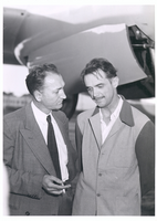 Photograph of Howard Hughes with unidentified man beside the second XF-11, April 4, 1947