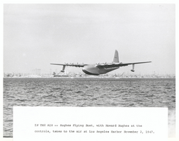Photograph of the Hughes Flying Boat flying over the Los Angeles Harbor, November 2, 1947