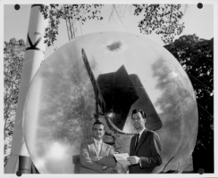 Photograph of Nicholas Begovich and E.W. Templin with Frescanar antenna, 1957