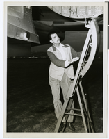 Photograph of Howard Hughes under the second XF-11, April 3, 1947