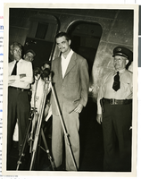 Photograph of Howard Hughes at a press conference beside his Douglas DC-3, New York, April, 1947