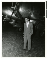 Photograph of Howard Hughes under the propeller of his DC-3, April, 1947