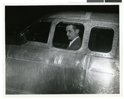 Photograph of Howard Hughes in the cockpit of his DC-3, April, 1947