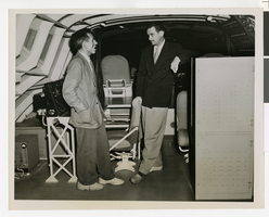 Photograph of Howard Hughes and unidentified man on the flight deck of the Flying Boat, May 12, 1947