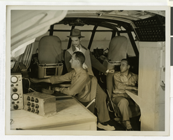 Photograph of Howard Hughes and pilots in the cockpit of the Flying Boat, November 1, 1947