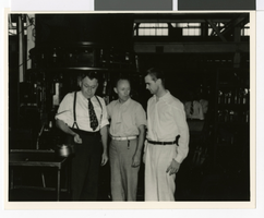Photograph of Howard Hughes and two men, Houston, Texas, July 30, 1938