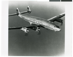 Photograph of the Trans World Airline plane in flight, circa 1946-1956