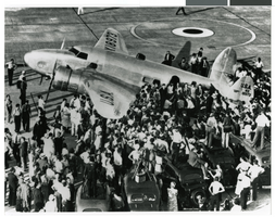 Photograph of spectators around the Lockheed 14 at the Floyd Bennett Airport, New York, October 7, 1938