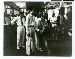 Photograph of Howard Hughes visiting the Hughes Tool Company, Houston, Texas, July 30, 1938