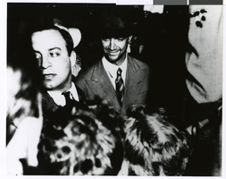 Photograph of Howard Hughes after arriving from his flight around the world, New York, July 13, 1938