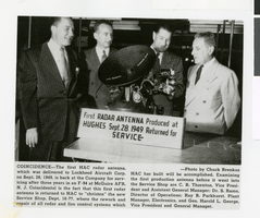 Photograph of Charles B. Thornton, S. Ramo, and others with the first Hughes Aircraft Company radar antenna, 1952