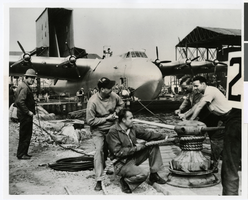 Photograph of workmen moving the Hughes HK-1 Flying Boat in Terminal Island at the Los Angeles Harbor, November 1, 1947