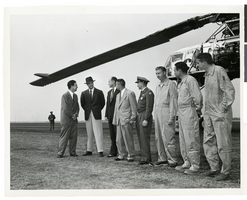 Photograph of Howard Hughes with a group of men in front of the XH-17 helicopter, Culver City, California, October 23, 1952