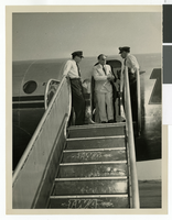 Photograph of crew and passengers outside of a TWA aircraft, circa 1940-1950s