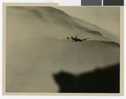 Photograph of an unidentified plane flying through clouds, May 2, 1947