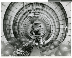 Photograph of men working on the interior of the Hughes HK-1 Flying Boat, Los Angeles Harbor, October 31, 1947