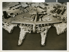 Aerial photograph of the Hughes HK-1 Flying Boat at Terminal Island in the Los Angeles Harbor, circa 1946