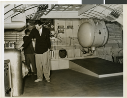 Photograph of Howard Hughes and crew member inside of the HK-1 Flying Boat, 1947