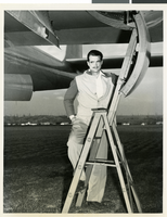 Photograph of Howard Hughes, standing by the XF-11, April 3, 1947