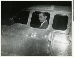 Photograph of Howard Hughes inside of a DC-3, April, 1947