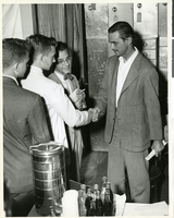Photograph of Howard Hughes with three unidentified men circa late 1940s/early 1950s