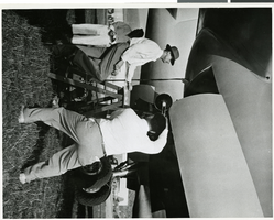 Photograph of Hughes inspecting one of his planes, approximately 1945-1955