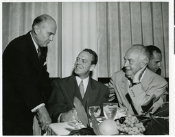 Photograph of General Eaker, Clifford, and Dutch Kindelberger, attending a banquet, circa 1940s-1950s