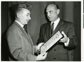 Photograph of Ira C. Eaker giving out an award, circa 1940s-1950s