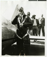 Photograph of Howard Hughes drinking water, 1936