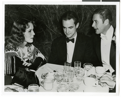 Photograph of Lily Pons, Howard Hughes, and Errol Flynn, Beverly Hills, California, circa late 1930s