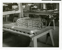 Photograph of an airplane part during assembly, circa 1920s-1950s