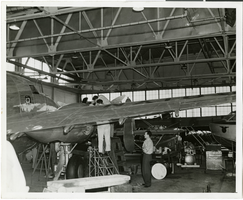 Photograph of the Lockheed 14 aircraft in a hangar in New York, New York, July 9, 1938
