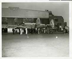 Photograph of people surrounding the Lockheed 14 aircraft, New York, July 9, 1938