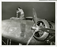Photograph of Hiram "Tommy" Thurlow and the Lockheed 14, New York, July 9, 1938