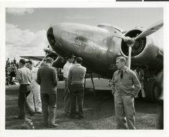 Photograph of Howard Hughes and the Lockheed 14 aircraft, Fairbanks, Alaska, July 15, 1938