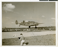 Photograph of Howard Hughes's plane taking off, Minneapolis, Minnesota, July 14, 1938