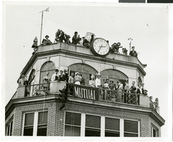 Photograph of people atop a tower awaiting the arrival of Howard Hughes, New York, July 14, 1938