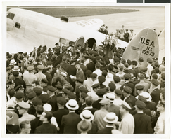 Photograph of Howard Hughes and crowds at Floyd Bennett Airfield, New York, July 14, 1938