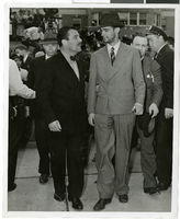 Photograph of Howard Hughes and Grover Whalen at Floyd Bennett Airfield, New York, July 14, 1938